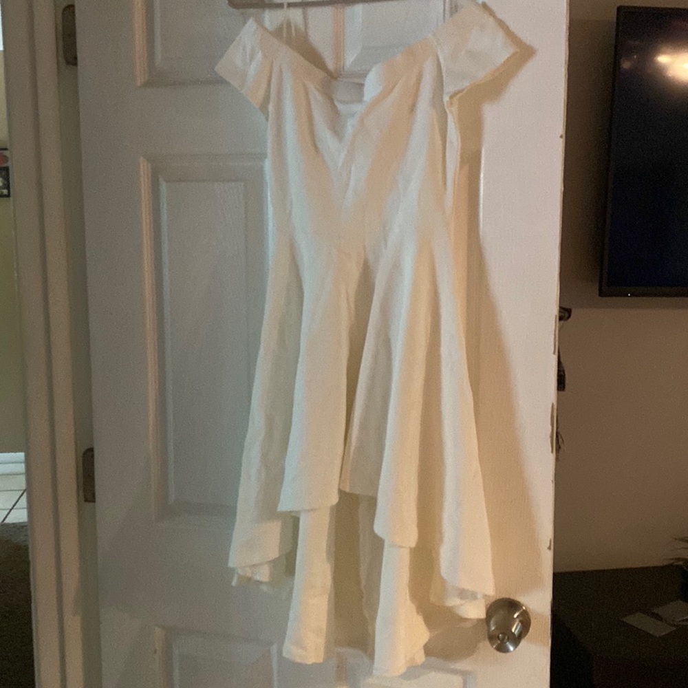 Mid length white dress that is short sleeved